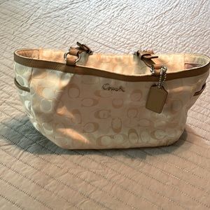 Coach purse. Cream with tan leather straps. Lavender lining.